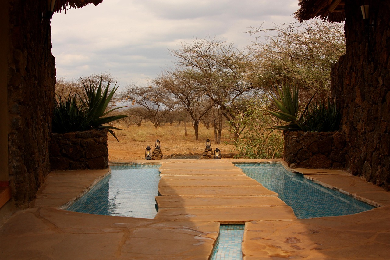 A luxury safari tent with a private deck and hot tub overlooking the Texas Hill Country landscape