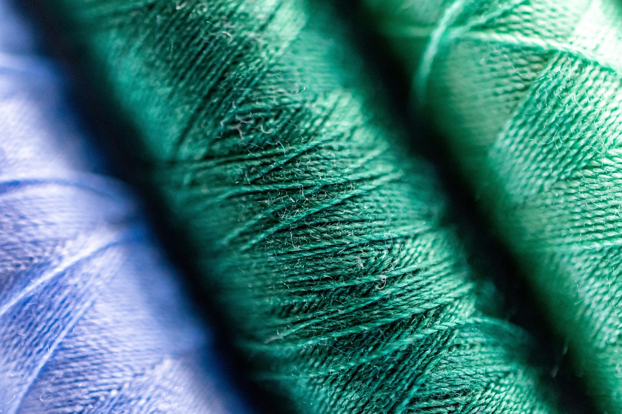 Close-up view of a soft merino wool sweater fabric showing its fine weave