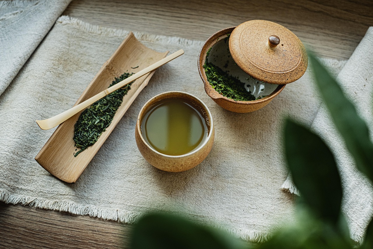 A gift set including a ceramic planter, small bag of organic potting mix, and a moisture meter on a table