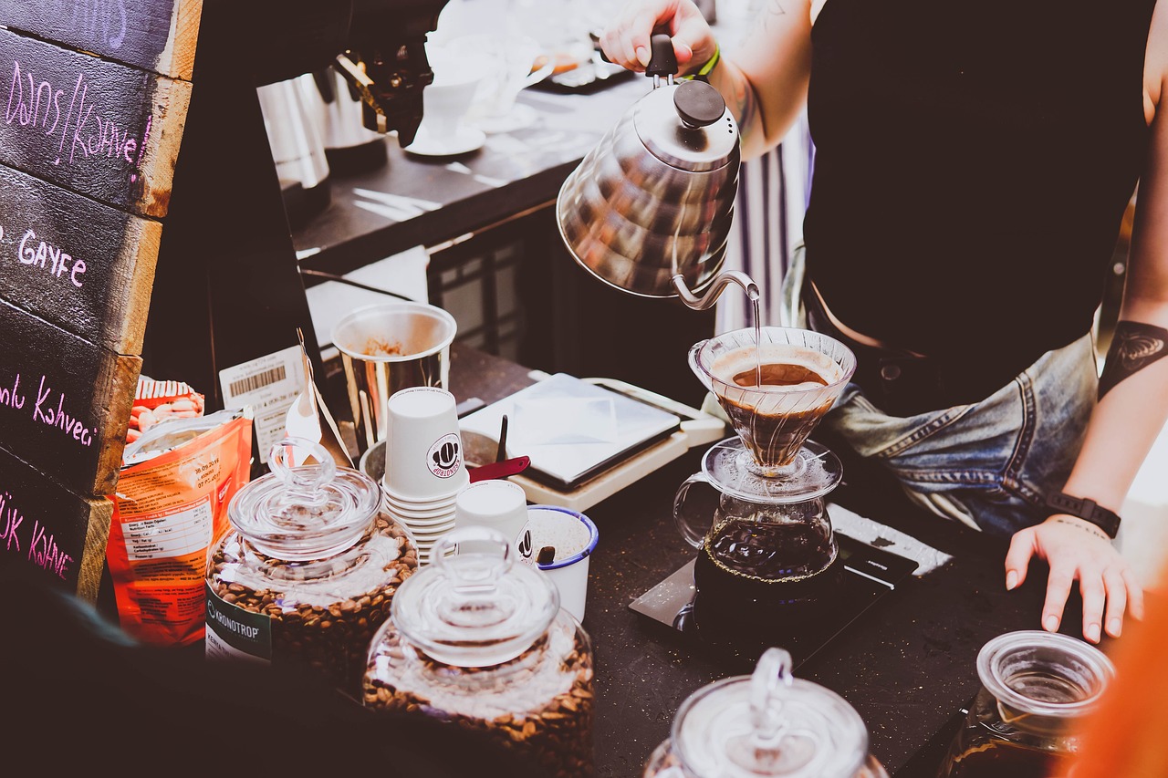 Pour over coffee brewing setup with glass V60 and gooseneck kettle