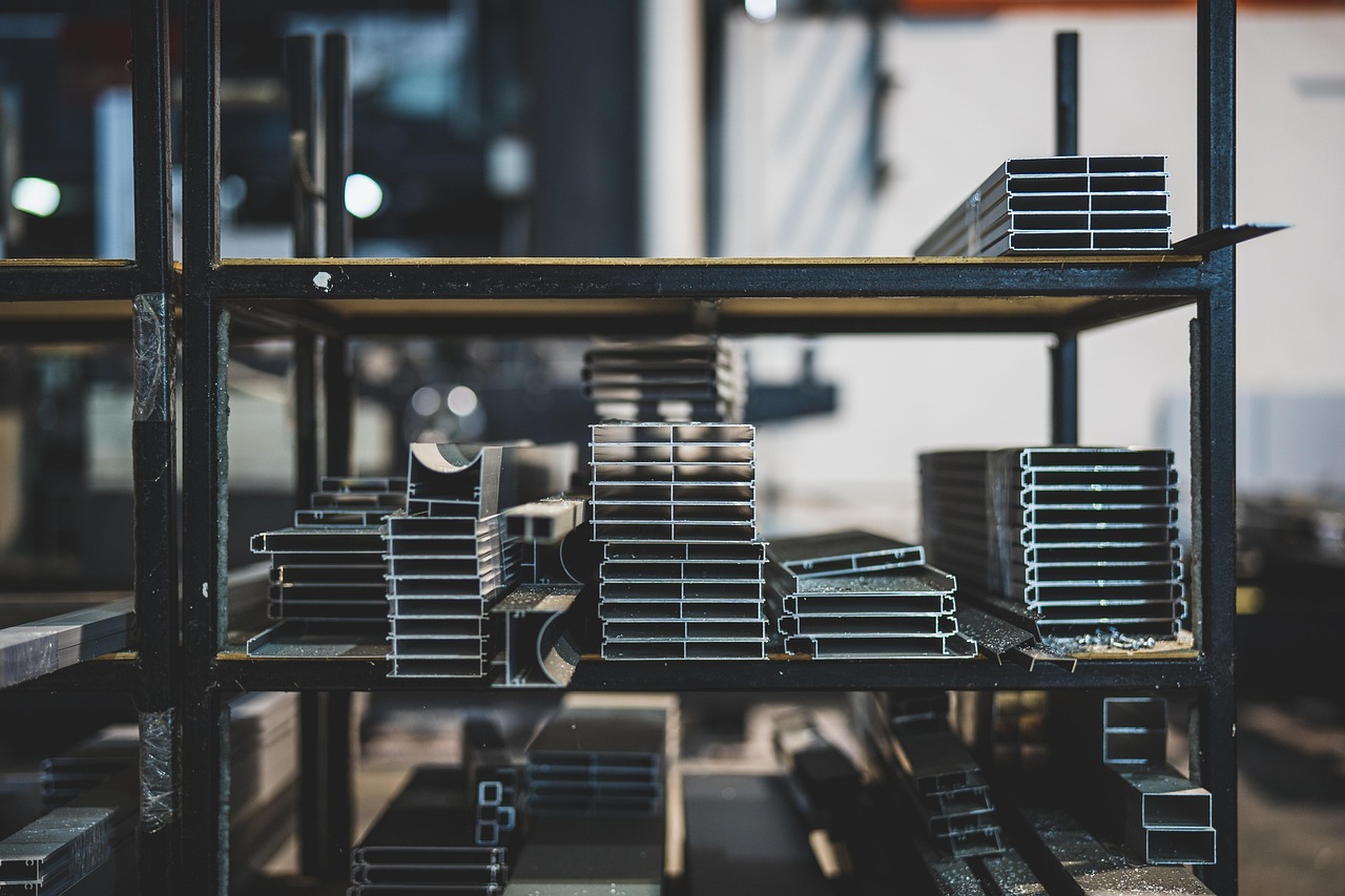 Stainless steel food storage containers arranged on a kitchen counter during testing