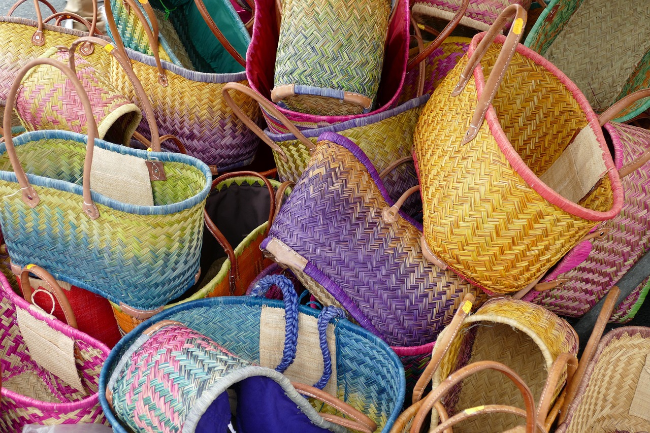 A mesh laundry bag filled with used reusable makeup remover pads ready for washing