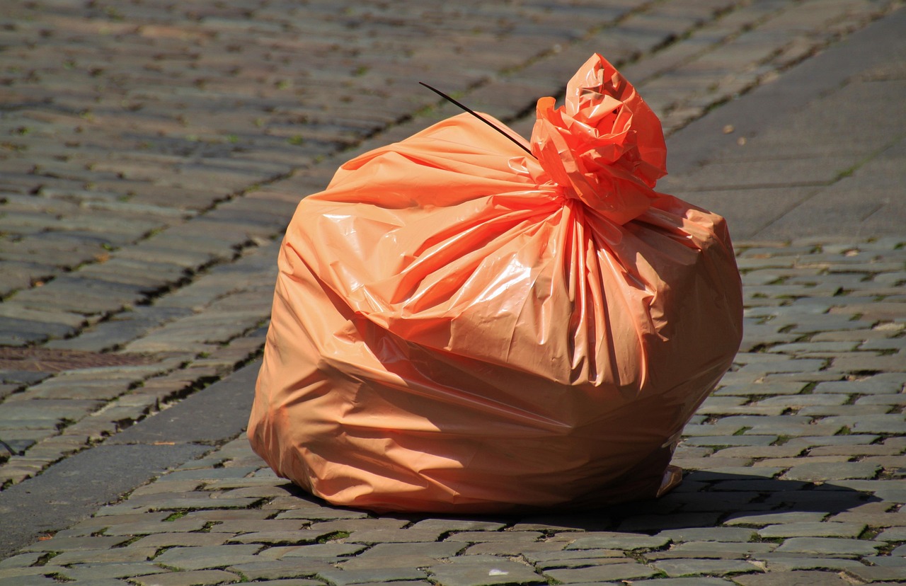 Biodegradable yard waste bags filled with leaves and sticks